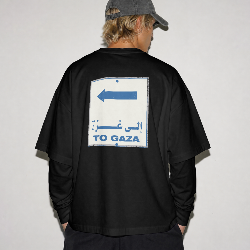 To Gaza box tee in black worn by a model, back view with To Gaza road sign print