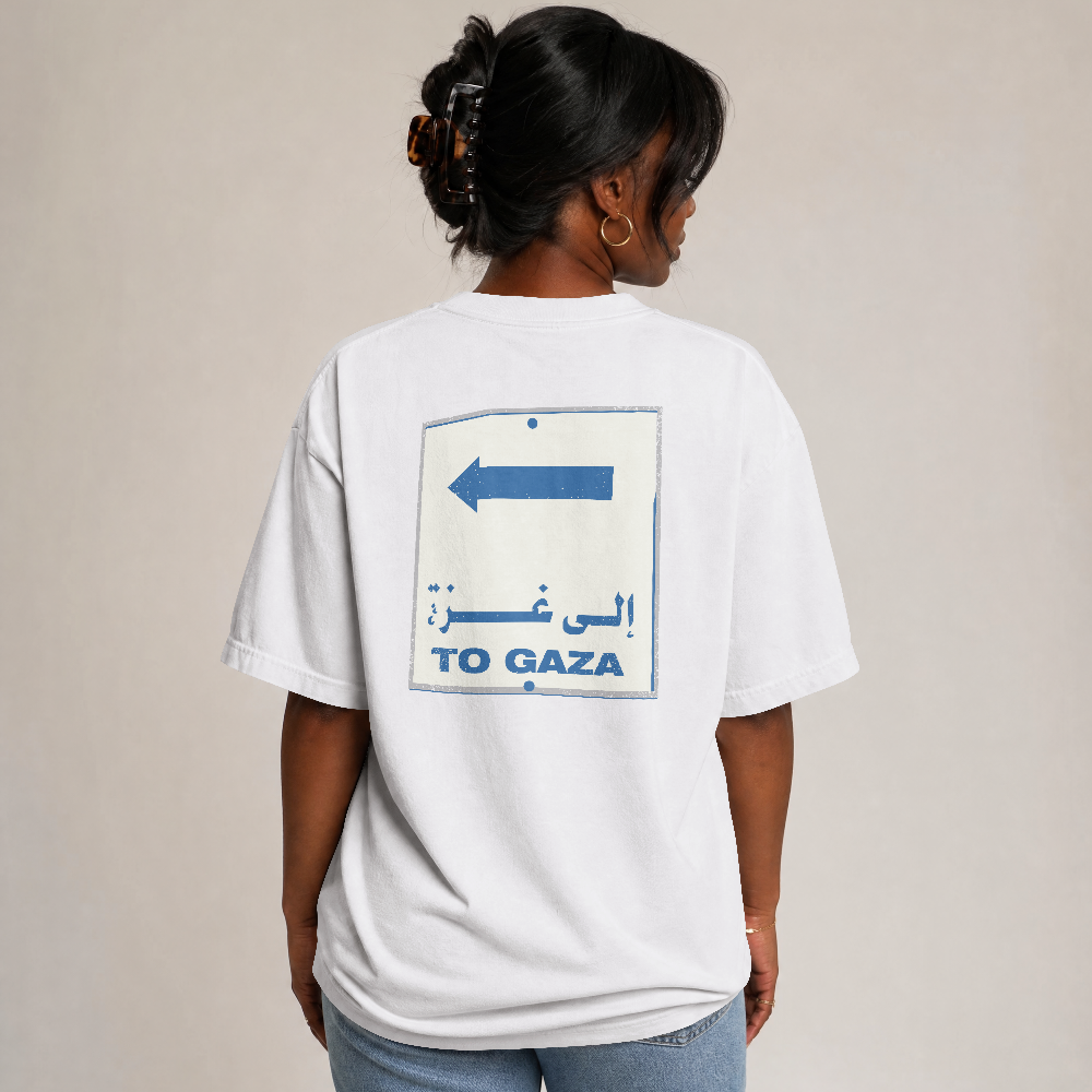 To Gaza box tee in white worn by a model, back view with To Gaza road sign print